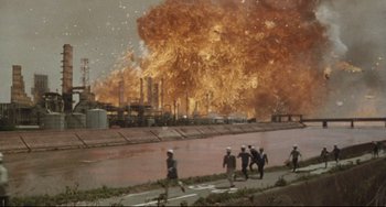 Movie still from “Godzilla vs. Mechagodzilla II” (1993), directed by Kazuki Ômori – A group of people standing next to a body of water; Extreme Wide shot, High angle