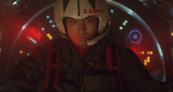 Movie still from “Godzilla vs. Mechagodzilla II” (1993), directed by Kazuki Ômori – A man wearing a helmet in a dark room; Close Up shot, Low angle