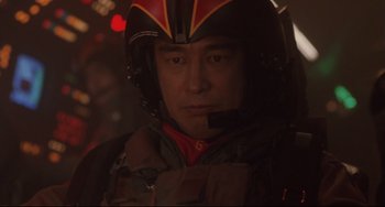 Movie still from “Godzilla vs. Mechagodzilla II” (1993), directed by Kazuki Ômori – A man wearing a helmet in the dark; Close Up shot, Low angle