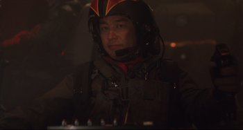 Movie still from “Godzilla vs. Mechagodzilla II” (1993), directed by Kazuki Ômori – A man wearing a helmet is in the dark; Close Up shot, Low angle