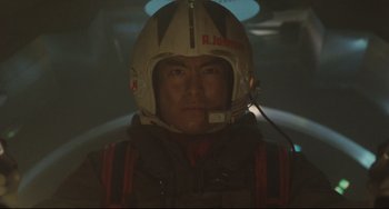 Movie still from “Godzilla vs. Mechagodzilla II” (1993), directed by Kazuki Ômori – A man wearing a helmet in a dark room; Close Up shot, Low angle