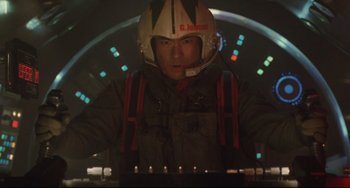 Movie still from “Godzilla vs. Mechagodzilla II” (1993), directed by Kazuki Ômori – A man wearing a helmet is standing in front of a computer keyboard; Medium shot, Low angle