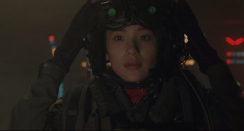 Movie still from “Godzilla vs. Mechagodzilla II” (1993), directed by Kazuki Ômori – A person wearing a helmet in a dark room; Close Up shot, Low angle