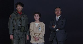 Movie still from “Godzilla vs. Mechagodzilla II” (1993), directed by Kazuki Ômori – A group of people standing next to each other; Medium shot, Low angle
