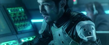 Movie still from “Godzilla: Final Wars” (2004), directed by Koji Hashimoto – A person wearing a leather jacket; Close Up shot, Over the shoulder angle