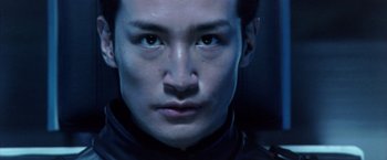 Movie still from “Godzilla: Final Wars” (2004), directed by Koji Hashimoto – A man's face in the dark; Extreme Close Up shot, Low angle