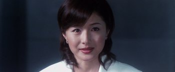 Movie still from “Godzilla: Final Wars” (2004), directed by Koji Hashimoto – A person wearing a white shirt; Close Up shot, Low angle
