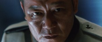Movie still from “Godzilla: Final Wars” (2004), directed by Koji Hashimoto – A man's eyes and face; Extreme Close Up shot, Low angle
