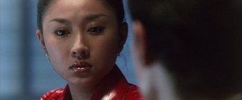 Movie still from “Godzilla: Final Wars” (2004), directed by Koji Hashimoto – A person wearing a red jacket; Close Up shot, Low angle