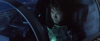 Movie still from “Godzilla: Final Wars” (2004), directed by Koji Hashimoto – A young man in a car at night looking at the camera; Close Up shot, Low angle