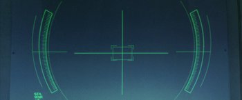 Movie still from “Godzilla: Final Wars” (2004), directed by Koji Hashimoto – A green square is drawn on a blue background; Extreme Close Up shot, Overhead angle