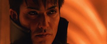 Movie still from “Godzilla: Final Wars” (2004), directed by Koji Hashimoto – A man's face in the dark; Extreme Close Up shot, High angle