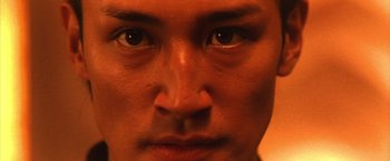Movie still from “Godzilla: Final Wars” (2004), directed by Koji Hashimoto – A man's eyes and face; Extreme Close Up shot, Low angle