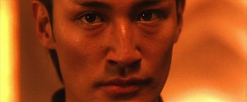 Movie still from “Godzilla: Final Wars” (2004), directed by Koji Hashimoto – A man's eyes and face; Extreme Close Up shot, Low angle