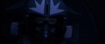 Movie still from “Godzilla: Tokyo S.O.S.” (2003), directed by Takao Okawara – A person wearing a helmet with a leaf on it's face; Close Up shot, Low angle