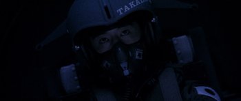 Movie still from “Godzilla: Tokyo S.O.S.” (2003), directed by Takao Okawara – A man wearing a helmet and goggles in a dark room; Close Up shot, Overhead angle
