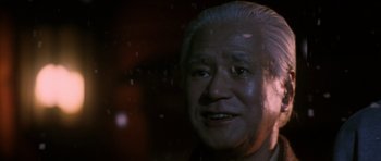 Movie still from “Godzilla: Tokyo S.O.S.” (2003), directed by Takao Okawara – An older man with a gray hair and a white beard; Close Up shot, Low angle