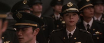 Movie still from “Godzilla: Tokyo S.O.S.” (2003), directed by Takao Okawara – A group of people in military uniforms standing next to each other; Close Up shot, Low angle