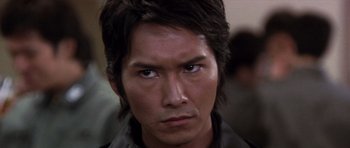 Movie still from “Godzilla: Tokyo S.O.S.” (2003), directed by Takao Okawara – A person with long brown hair; Close Up shot, High angle