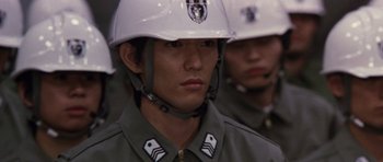 Movie still from “Godzilla: Tokyo S.O.S.” (2003), directed by Takao Okawara – A person wearing a helmet; Close Up shot, High angle