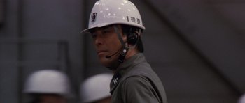 Movie still from “Godzilla: Tokyo S.O.S.” (2003), directed by Takao Okawara – A man wearing a hard hat and a headset; Close Up shot, Low angle