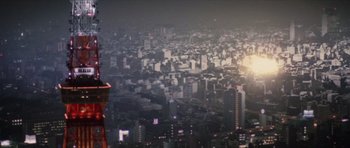 Movie still from “Godzilla: Tokyo S.O.S.” (2003), directed by Takao Okawara – A view of a large city at night from above; Extreme Wide shot, Low angle