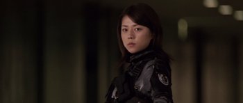 Movie still from “Godzilla: Tokyo S.O.S.” (2003), directed by Takao Okawara – A woman in a uniform is looking at the camera; Close Up shot, Low angle