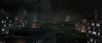 Movie still from “Godzilla: Tokyo S.O.S.” (2003), directed by Takao Okawara – A view of a city at night from a distance; Extreme Wide shot, High angle