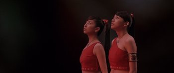 Movie still from “Godzilla: Tokyo S.O.S.” (2003), directed by Takao Okawara – A couple of women standing next to each other; Medium shot, Low angle