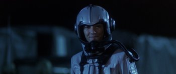 Movie still from “Godzilla: Tokyo S.O.S.” (2003), directed by Takao Okawara – A man in a space suit with a helmet on his head; Close Up shot, Low angle