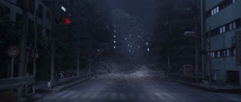 Movie still from “Godzilla: Tokyo S.O.S.” (2003), directed by Takao Okawara – A blurry image of an empty street at night; Extreme Wide shot, High angle