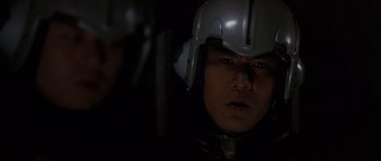 Movie still from “Godzilla: Tokyo S.O.S.” (2003), directed by Takao Okawara – A person wearing a helmet; Close Up shot, Over the shoulder angle
