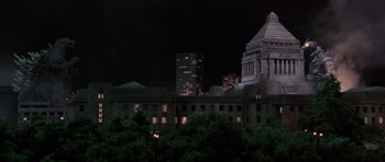 Movie still from “Godzilla: Tokyo S.O.S.” (2003), directed by Takao Okawara – A view of a city at night from a distance; Extreme Wide shot, Low angle