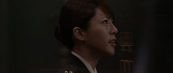 Movie still from “Godzilla: Tokyo S.O.S.” (2003), directed by Takao Okawara – A person wearing a uniform; Close Up shot, Low angle