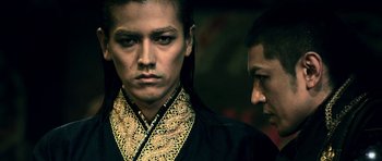 Movie still from “Goemon” (2009), directed by Kazuaki Kiriya – A man in a black shirt and a man in a black shirt; Close Up shot, Low angle