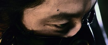 Movie still from “Goemon” (2009), directed by Kazuaki Kiriya – A person's face with a bug on it's forehead; Extreme Close Up shot, Low angle