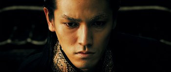 Movie still from “Goemon” (2009), directed by Kazuaki Kiriya – A person with a face close to the camera; Close Up shot, Low angle