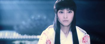 Movie still from “Goemon” (2009), directed by Kazuaki Kiriya – A young asian woman with long black hair; Close Up shot, Low angle