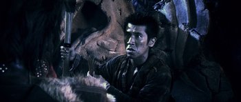 Movie still from “Goemon” (2009), directed by Kazuaki Kiriya – A man with a knife in his mouth; Close Up shot, Over the shoulder angle