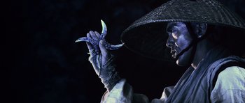 Movie still from “Goemon” (2009), directed by Kazuaki Kiriya – A person holding a pair of scissors in their hand; Close Up shot, Low angle