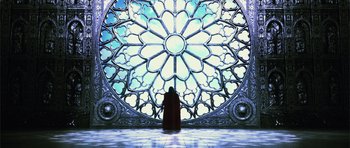 Movie still from “Goemon” (2009), directed by Kazuaki Kiriya – A person standing in front of a stained - glass window; Extreme Wide shot, Low angle