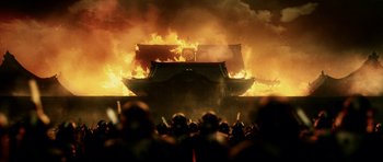 Movie still from “Goemon” (2009), directed by Kazuaki Kiriya – A fire is burning in the middle of a crowd; Extreme Wide shot, Low angle