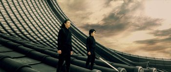 Movie still from “Goemon” (2009), directed by Kazuaki Kiriya – Two men are standing on the roof of a building; Medium shot, Low angle