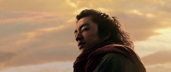 Movie still from “Goemon” (2009), directed by Kazuaki Kiriya – A man with a scarf on looking into the distance; Close Up shot, Low angle