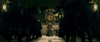 Movie still from “Goemon” (2009), directed by Kazuaki Kiriya – A group of people standing in front of a large clock; Extreme Wide shot, Low angle