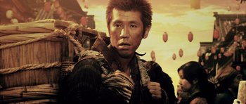 Movie still from “Goemon” (2009), directed by Kazuaki Kiriya – A man with a beard and a backpack; Close Up shot, Low angle