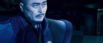 Movie still from “Goemon” (2009), directed by Kazuaki Kiriya – A painting of a man in a suit and tie; Close Up shot, Low angle