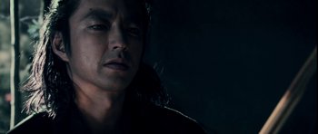 Movie still from “Goemon” (2009), directed by Kazuaki Kiriya – A man's face in the dark; Close Up shot, Low angle