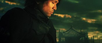 Movie still from “Goemon” (2009), directed by Kazuaki Kiriya – A person wearing a black jacket; Close Up shot, Low angle