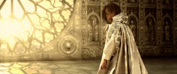 Movie still from “Goemon” (2009), directed by Kazuaki Kiriya – A man standing in front of an ornate wall; Medium shot, Low angle